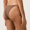 Braguitas de bikini de cobertura media con lazo y estampado de lunares pequeños Braguitas de bikini de cobertura media con lazo y estampado de lunares pequeños