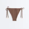 Braguitas de bikini de cobertura media con lazo y estampado de lunares pequeños Braguitas de bikini de cobertura media con lazo y estampado de lunares pequeños