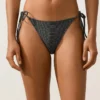 Braguitas de bikinis de cobertura media con lazos en jacquard con efecto lavado Braguitas de bikinis de cobertura media con lazos en jacquard con efecto lavado