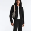 Chaqueta con volantes efecto neopreno y ribetes Chaqueta con volantes efecto neopreno y ribetes