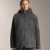 Chaqueta oversize de imitación de piel de oveja con capucha forrada de pelo sintético