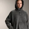 Chaqueta oversize de imitación de piel de oveja con capucha forrada de pelo sintético