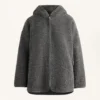 Chaqueta oversize de imitación de piel de oveja con capucha forrada de pelo sintético
