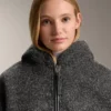 Chaqueta oversize de imitación de piel de oveja con capucha forrada de pelo sintético