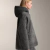 Chaqueta oversize de imitación de piel de oveja con capucha forrada de pelo sintético