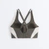 Compressive sports bra with firm support and reflective elements Compressive sports bra with firm support and reflective elements