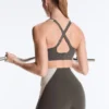 Compressive sports bra with firm support and reflective elements Compressive sports bra with firm support and reflective elements