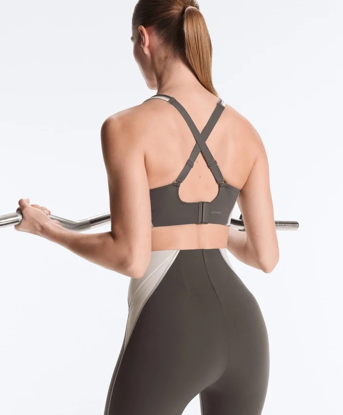 Compressive sports bra with firm support and reflective elements Compressive sports bra with firm support and reflective elements