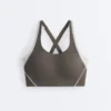 Compressive sports bra with firm support and reflective elements Compressive sports bra with firm support and reflective elements