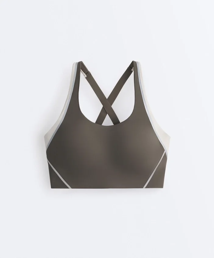 Compressive sports bra with firm support and reflective elements Compressive sports bra with firm support and reflective elements