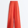 Pantalones de pierna ancha de piqué de algodón con pliegues