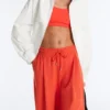 Pantalones de pierna ancha de piqué de algodón con pliegues