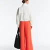 Pantalones de pierna ancha de piqué de algodón con pliegues