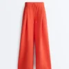 Pantalones de pierna ancha de piqué de algodón con pliegues