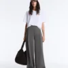 Pantalones de piqué de algodón de talle alto y corte ancho Pantalones de piqué de algodón de talle alto y corte ancho