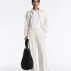 Chaqueta larga a rayas con cintura ajustable y modal Soft Touch Chaqueta larga a rayas con cintura ajustable y modal Soft Touch