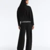 Pantalones de talle alto y corte ancho con efecto neopreno