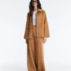 Pantalones de talle alto y corte ancho con efecto neopreno