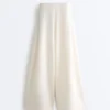Pantalones de tiro alto de sarga y pierna ancha con pliegues